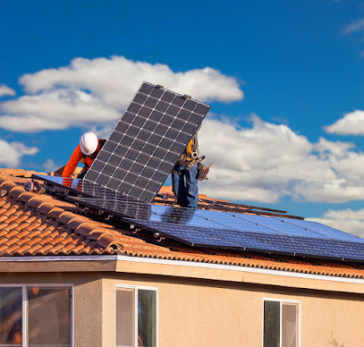 Workers Installing Solar Panels on House Roof.
